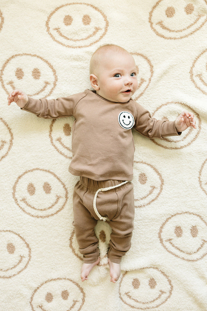 Smiley Fuzzy Blanket | Latte