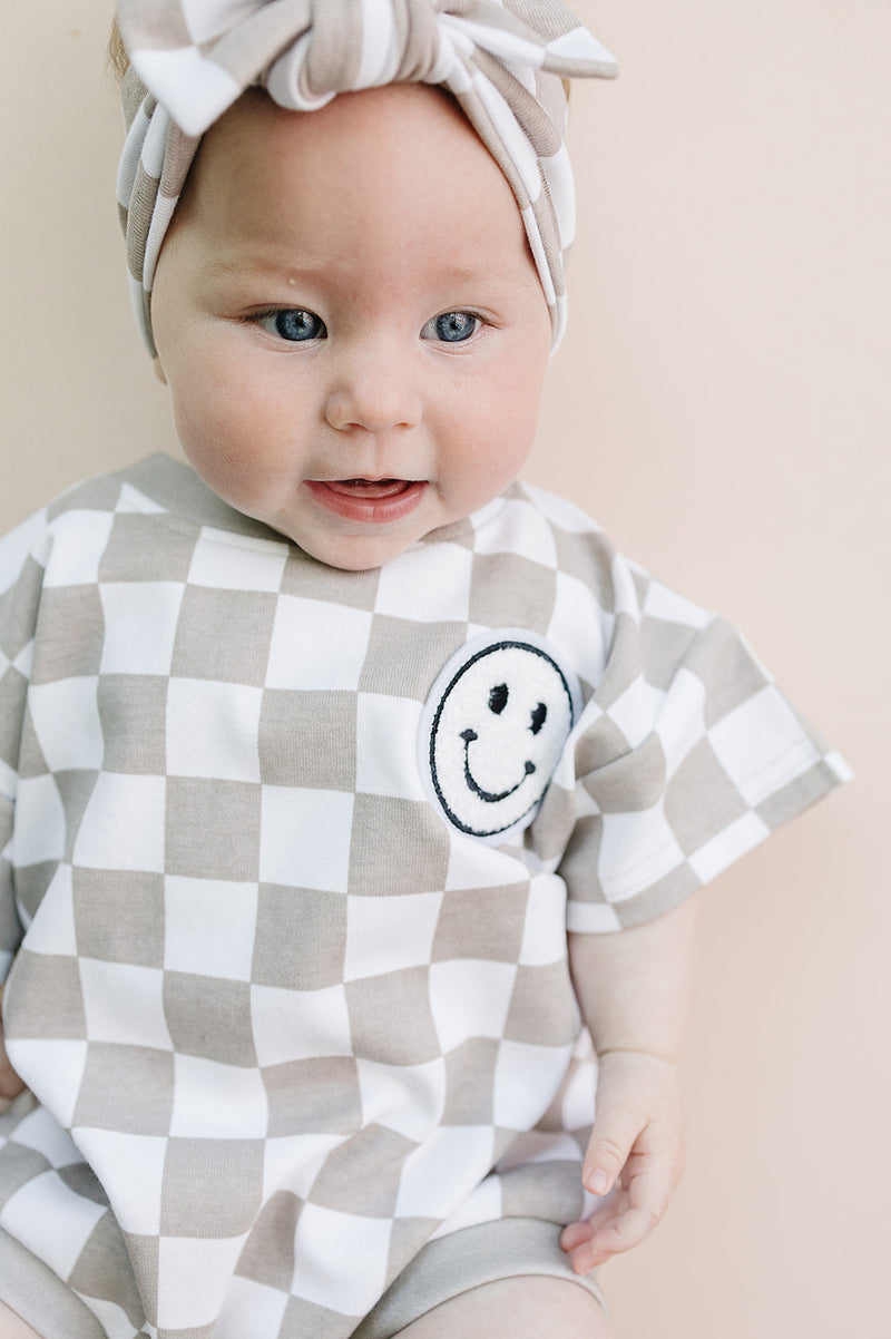 Short Sleeve Bubble Romper | Checkered Smiley Latte