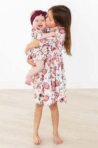 Footballs & Flowers 3/4 Sleeve Twirl Bodysuit